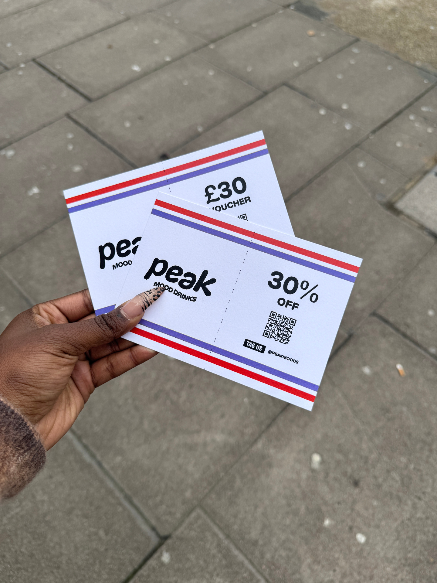Printed Peak Mood Drinks discount vouchers with red and blue stripe detail